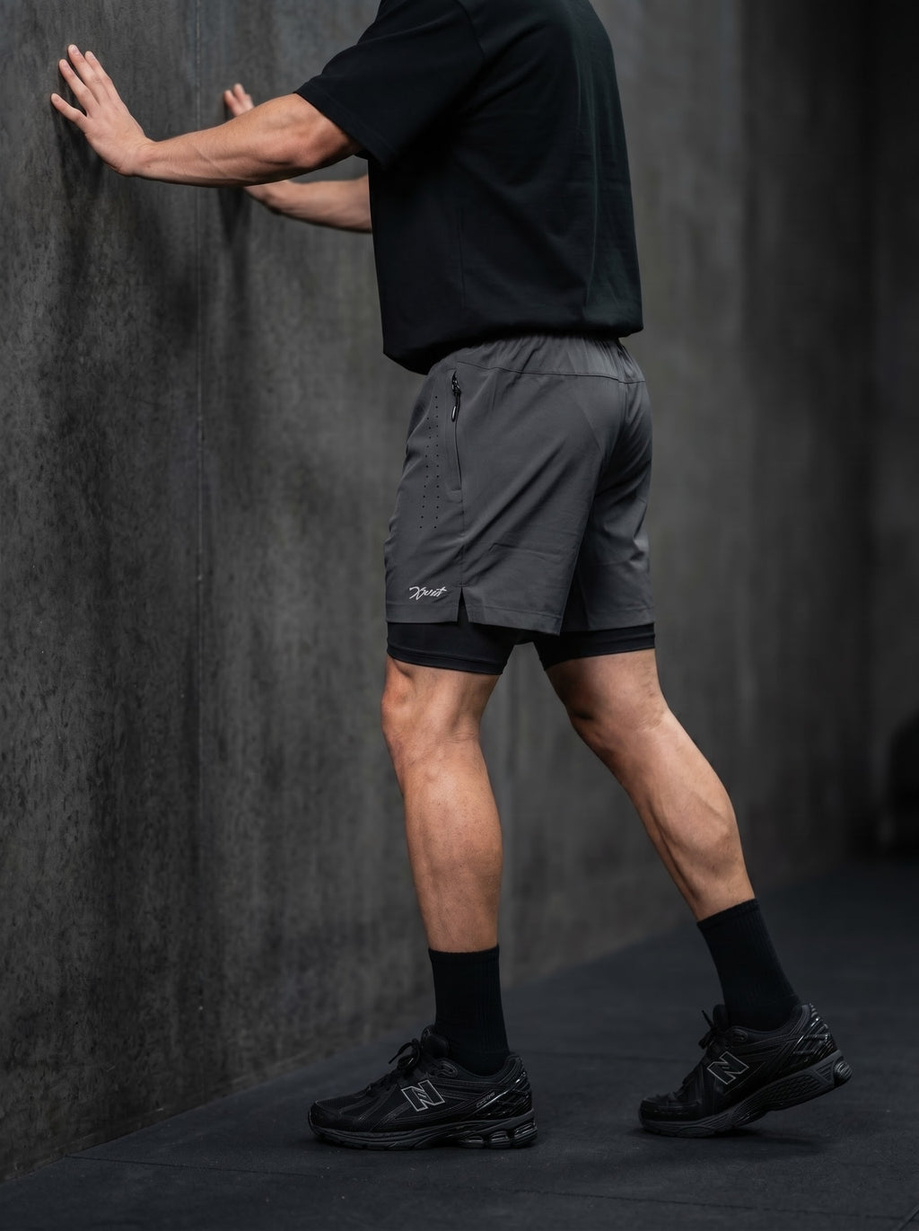 XZIZT gym shorts in dark grey, model posing #Color_Grey