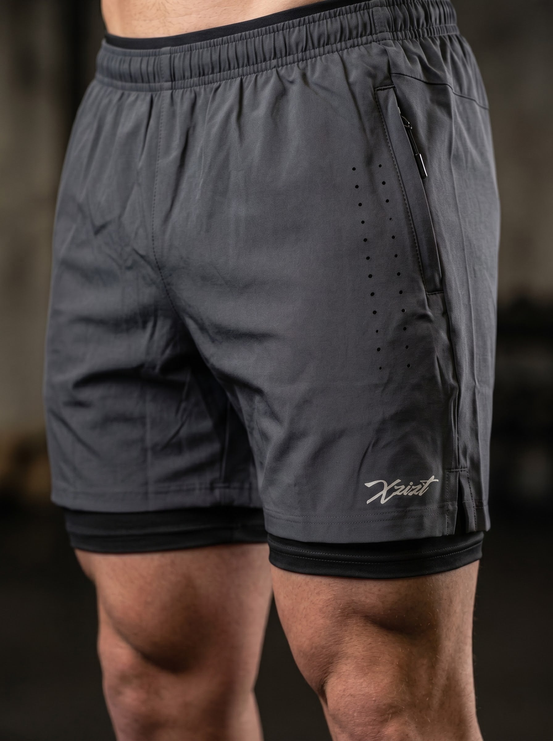 XZIZT gym shorts in dark grey, model posing #Color_Grey